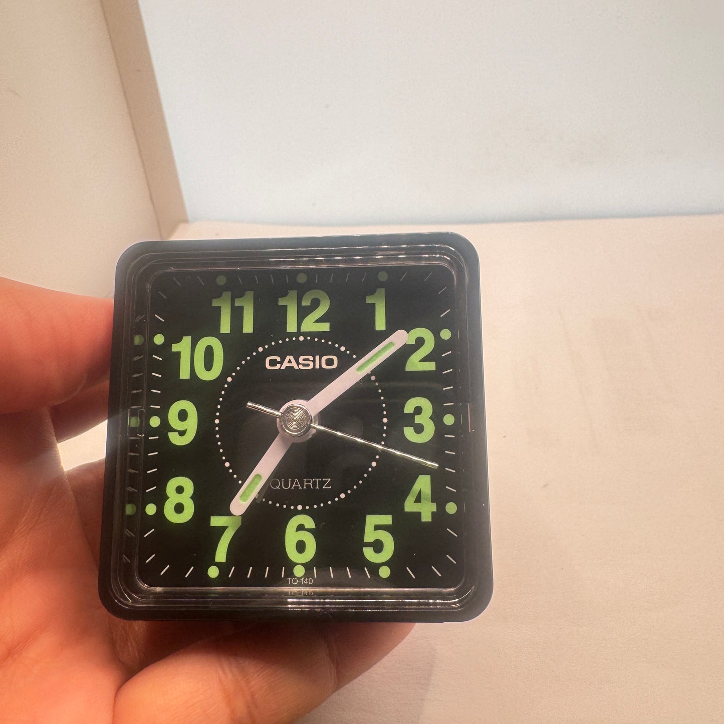 Small Alarm Clock By Casio Brand , Size 2”x 2” . Run by Battery AA . New Item