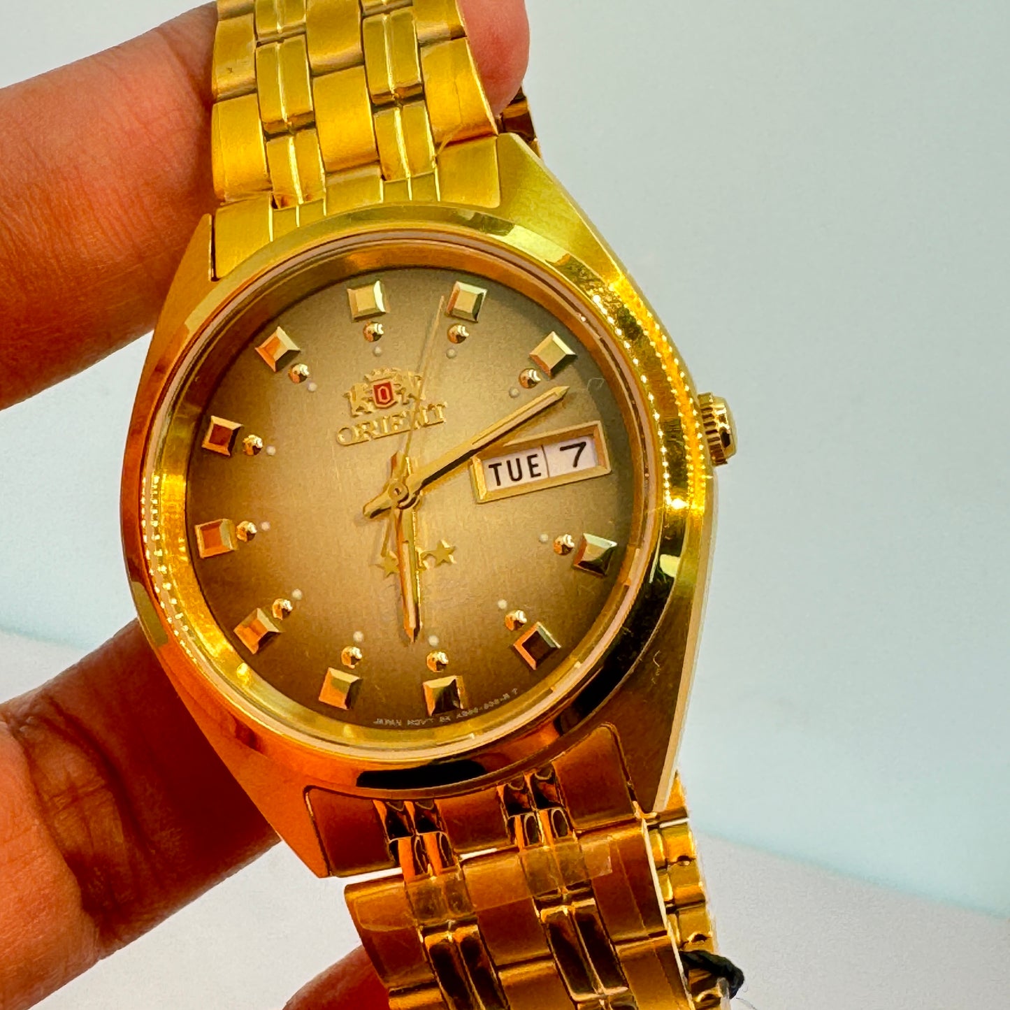 Goldtone Watch , Orient Brand , Automatic Movement , for Men , Brand New , Stainless Steel , 37 mm diameter 8 “ Wrist. round long