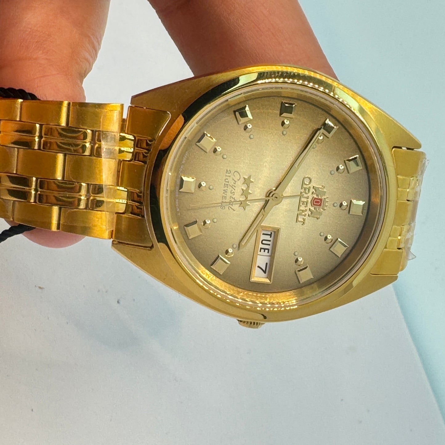 Goldtone Watch , Orient Brand , Automatic Movement , for Men , Brand New , Stainless Steel , 37 mm diameter 8 “ Wrist. round long
