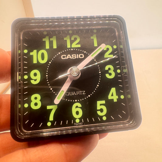 Small Alarm Clock By Casio Brand , Size 2”x 2” . Run by Battery AA . New Item