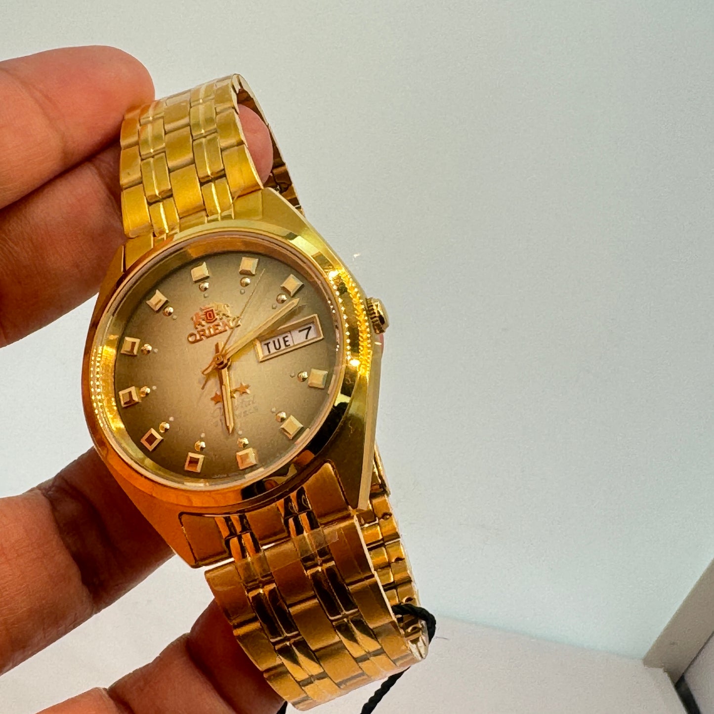 Goldtone Watch , Orient Brand , Automatic Movement , for Men , Brand New , Stainless Steel ,  37 mm diameter  8 “ Wrist. round long