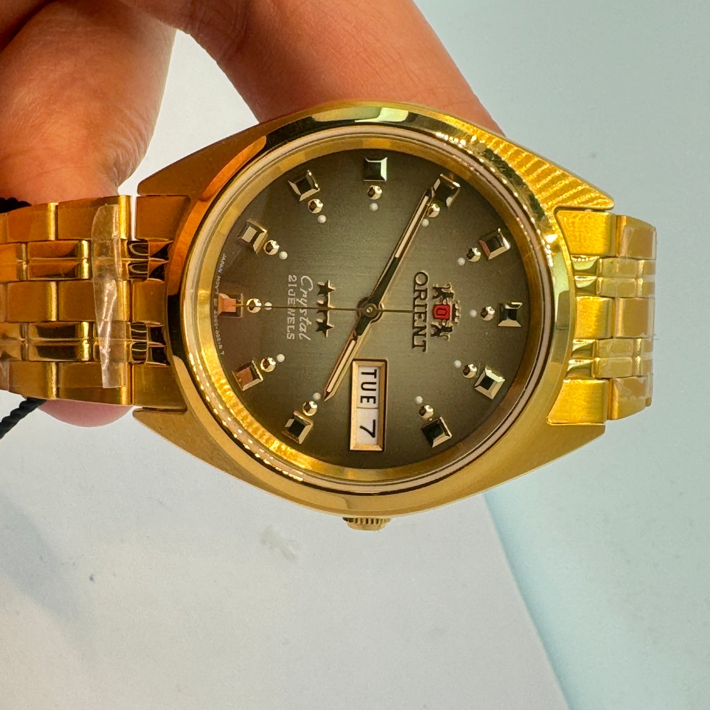 Goldtone Watch , Orient Brand , Automatic Movement , for Men , Brand New , Stainless Steel ,  37 mm diameter  8 “ Wrist. round long
